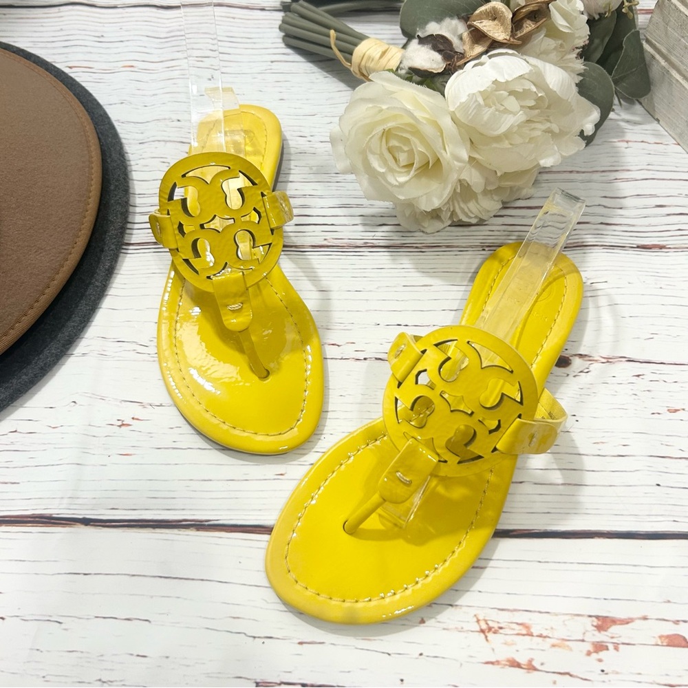 Tory Burch Miller patent leather sandals in a bright yellow